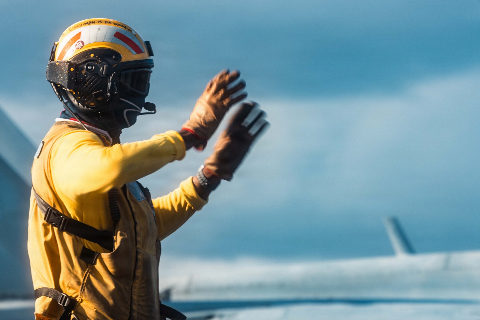 Crew member wearing a CMR-D hearing protection helmet during flight operations